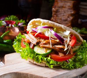 Crunchy pita with grilled gyros meat. Various vegetables and garlic sauce